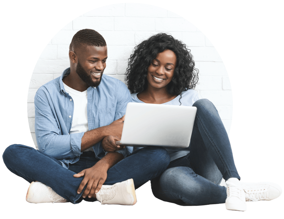 Couple looking at a laptop together