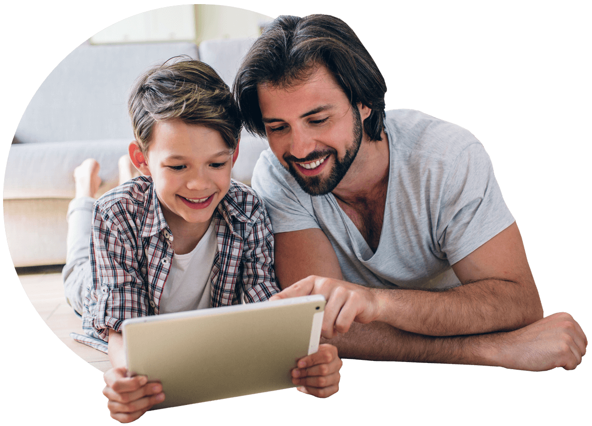 Parent and son looking at a tablet